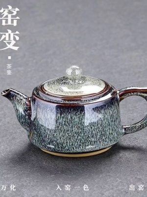 The peacock-green kiln-transformed teapot